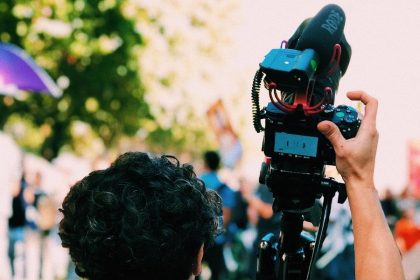 man holding DSLR camera