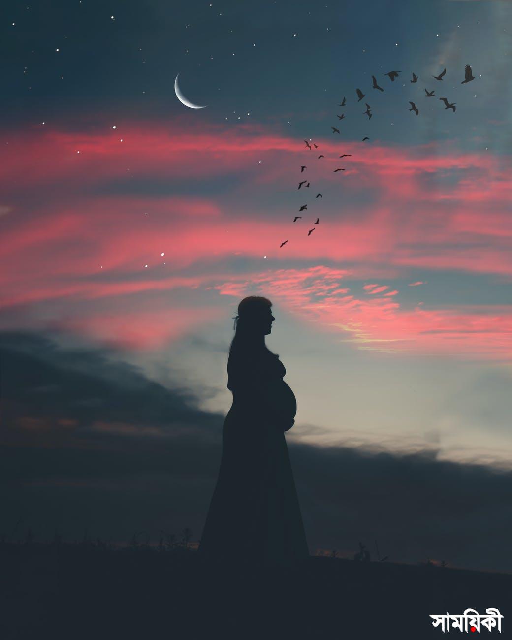 pregnant woman under cloudy sky in silhouette photography
