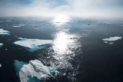 landscape and aerial photography of icebergs on body of water during daytime